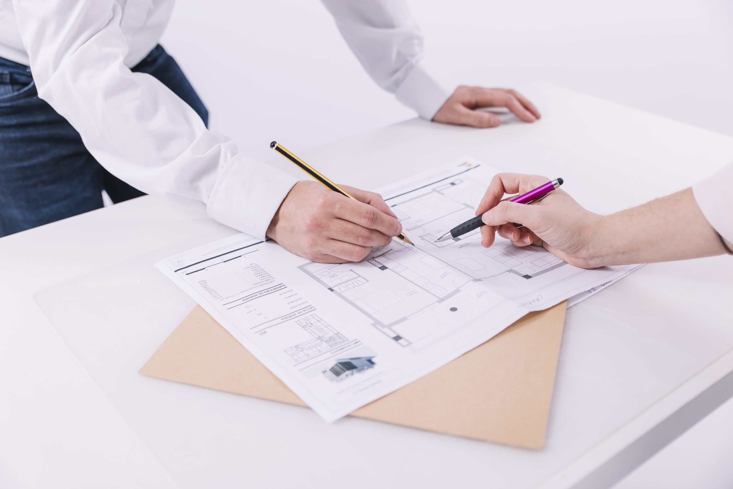 crop-hands-correcting-blueprint